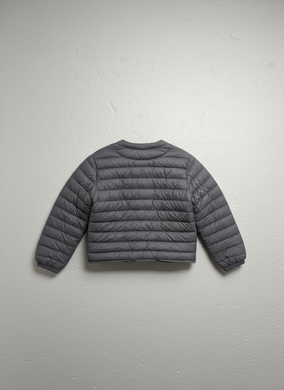 Gray puffer jacket on a light gray background