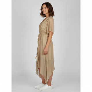 Woman wearing a beige dress on a white background